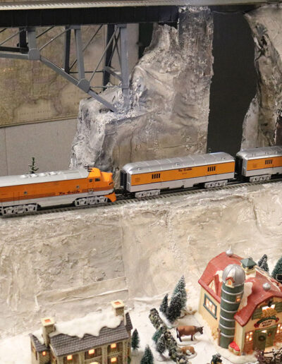 model railroad train going thru tunnel